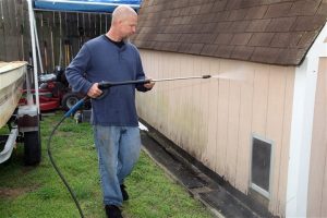 man doing backyard project